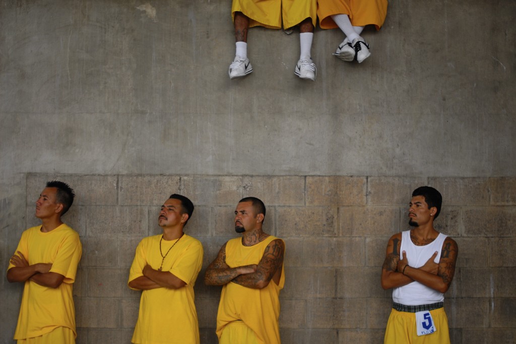 Members of the 18th Street gang attend a mass at the prison of Izalco