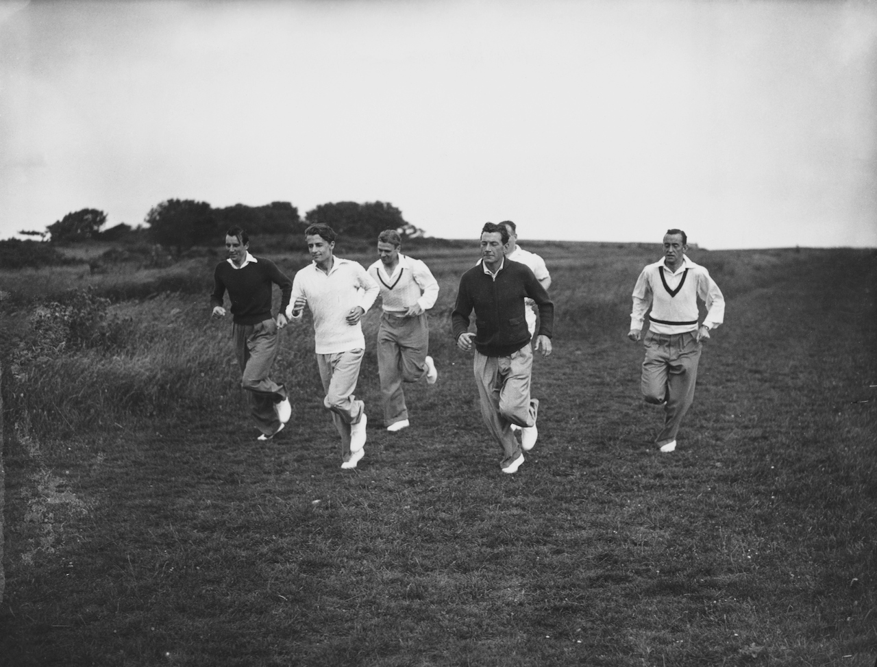 English Davis Cup tennis team members (left to right) Fred Perry (1909 - 1995), Bunny Austin (1906 - 2000), Raymond Tuckey (1910 - 2005), Dan Maskell (1908 - 1992) and Pat Hughes (1902 - 1997) training on Beachy Head, Sussex, 14th July 1936. They are working with Arsenal football club's trainer, Tom Whittaker. (Photo by Topical Press Agency/Hulton Archive/Getty Images)